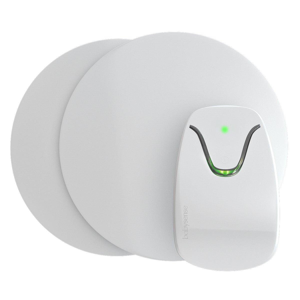 Babysense 7 kontrolenhed med to sensorpuder, der placeres under barnets madras